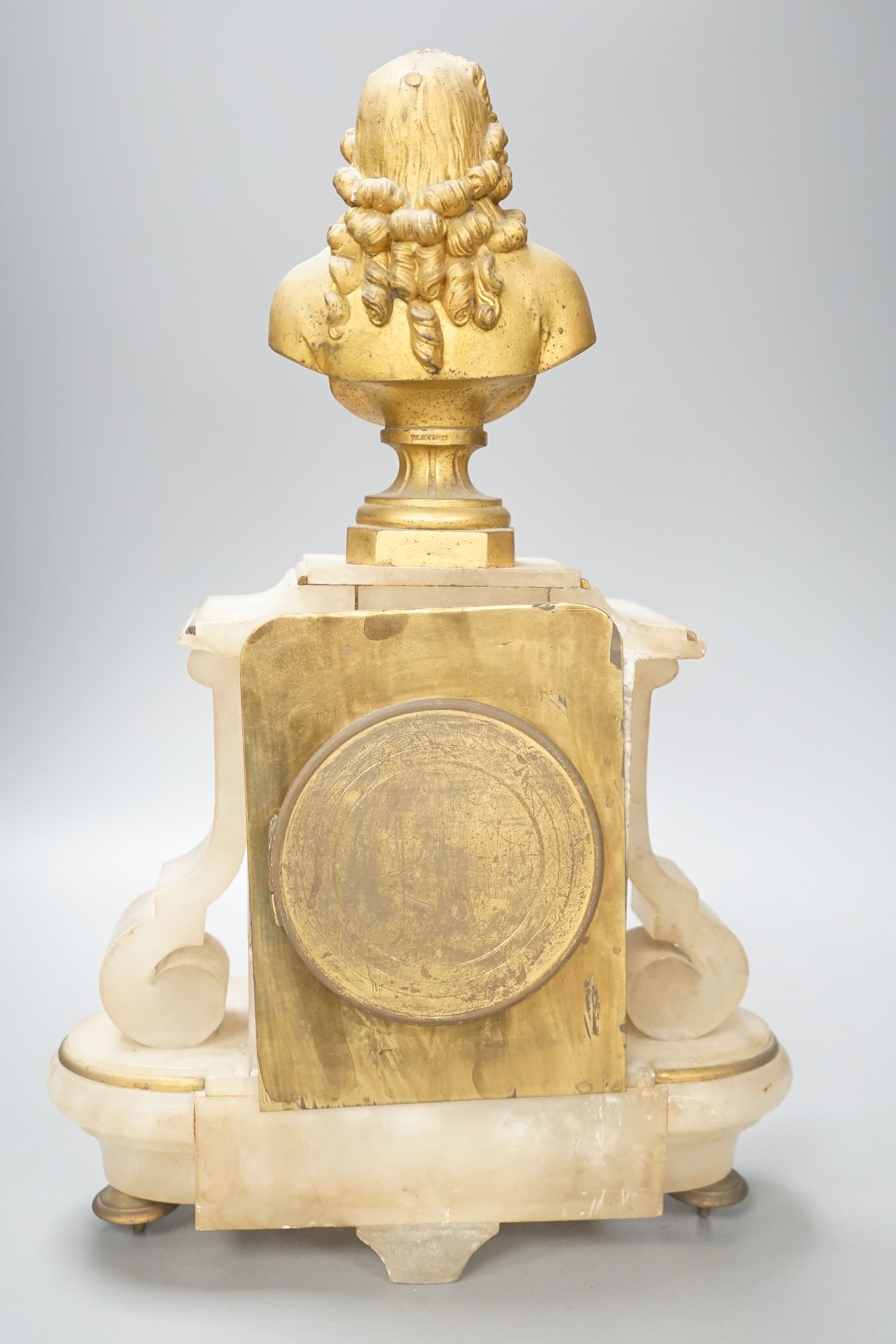 A 19th century French spelter and alabaster mantel clock, 40cm